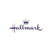 Purple script wordmark logo for Hallmark with a small crown above the lettering.