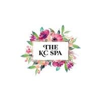 Logo for The KC Spa framed by a wreath of painted watercolor flowers.